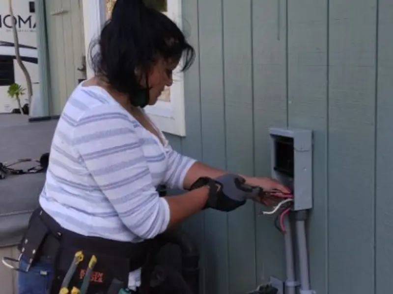 Licensed electrician wiring an exterior subpanel in Arizona City