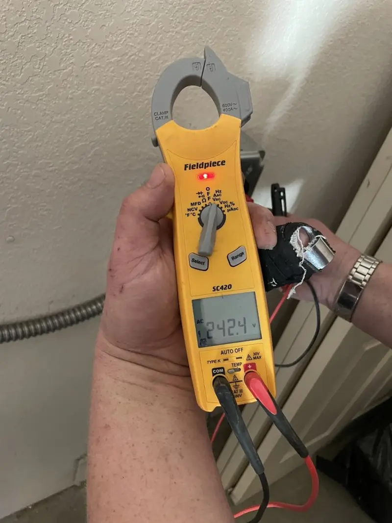 Voltage testing with clamp meter during Ceiling Fan Installation in Arizona City